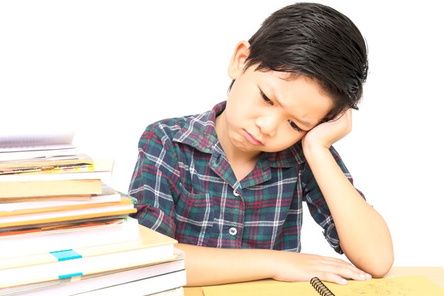 boy-is-unhappy-doing-homework_1150-6279